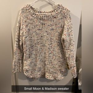 White with colored speckles through it